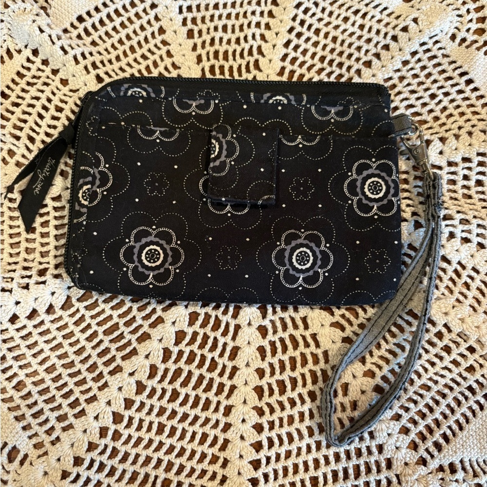 Thirty-One brand wristlet, in the "Onyx Blossom" pattern.